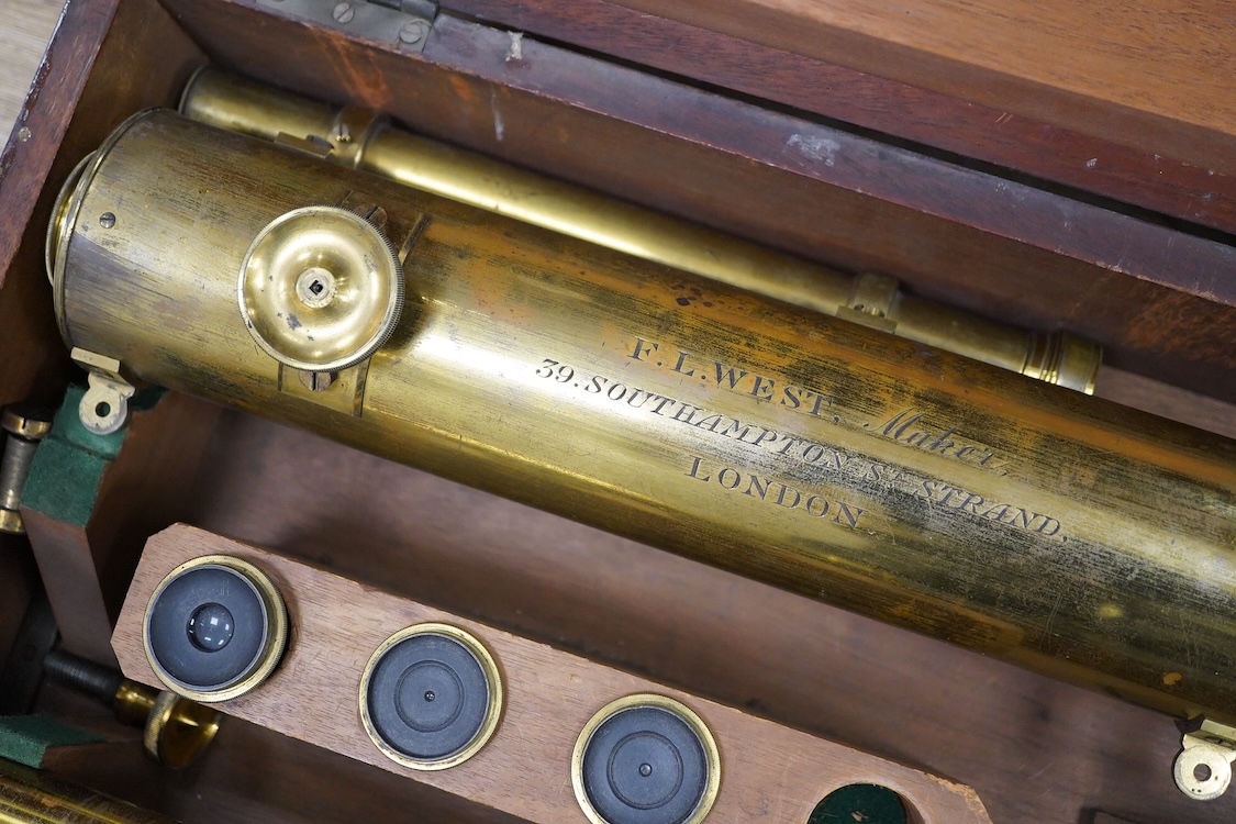 A late 19th century brass single drawer refracting telescope by F.L. West, 39 Southampton Street, Strand, London, in a fitted mahogany case, with folding brass tabletop tripod stand, and a number of alternative lenses, t